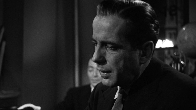 Humphrey Bogart in a suit talking