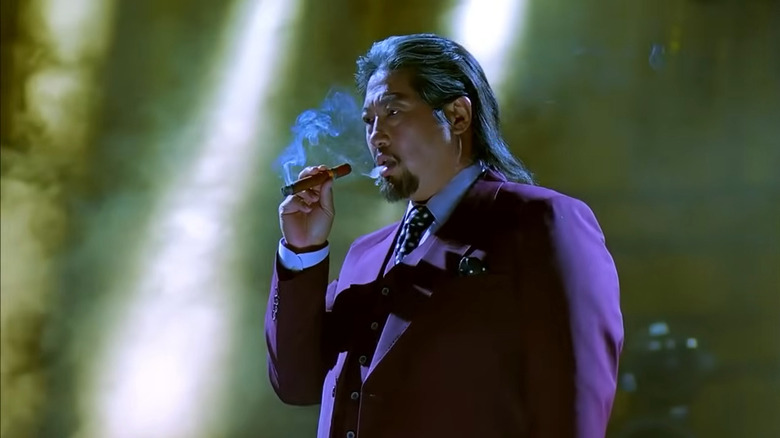 Sammo Hung smoking a cigar