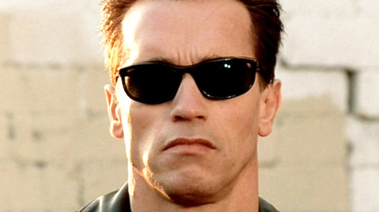 The T-800 glares in sunglasses