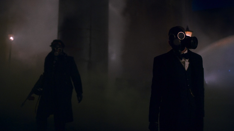 Arthur and Charlie wear gas masks