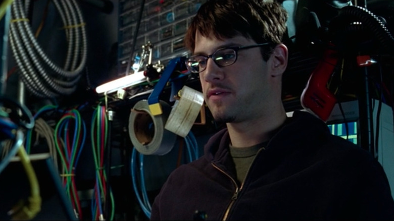 Riley looking at his laptop