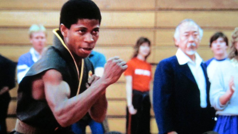 Larry B. Scott as a member of Cobra Kai in The Karate Kid