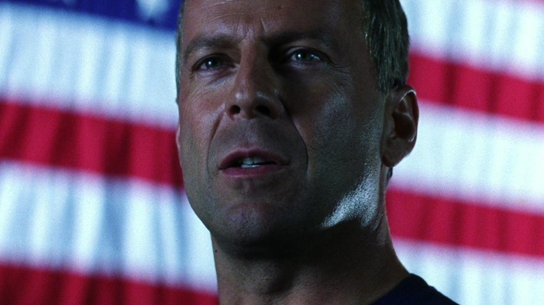 Harry S. Stamper standing in front of the American flag in Armageddon