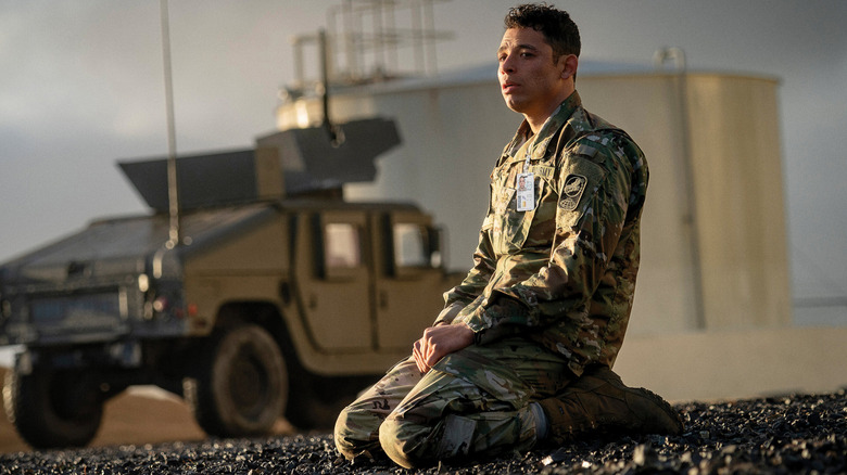 Major Daniel Gonzalez kneeling on a road in A House of Dynamite