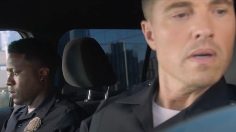 Aaron and Tim in squad car looking anxious