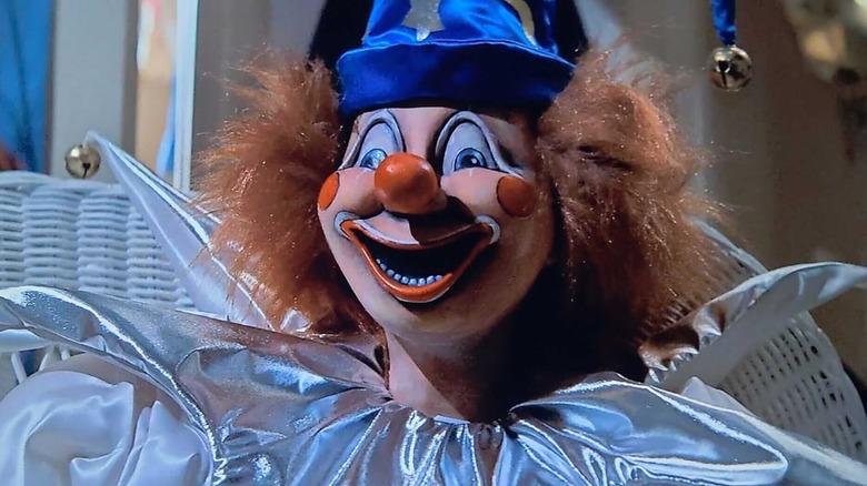 Clown doll grabbing Robbie