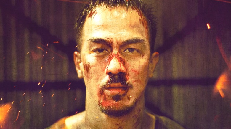 Joe Taslim with bloody face