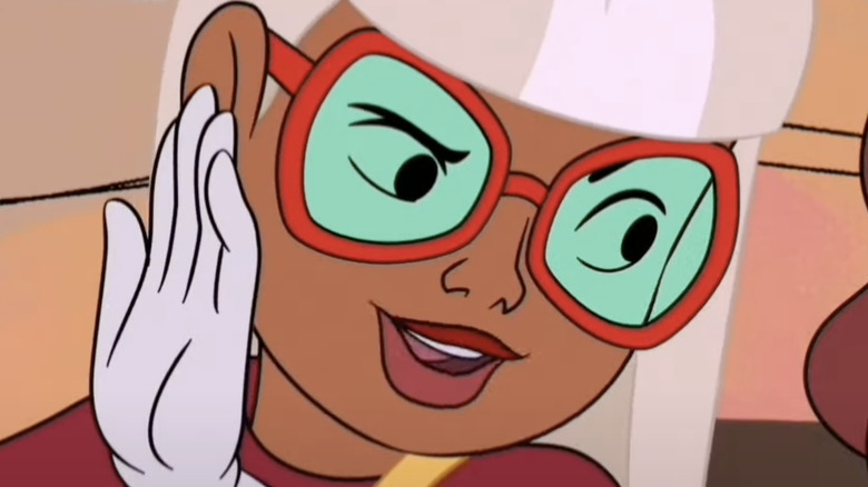 Coco Diablo wearing red framed glasses