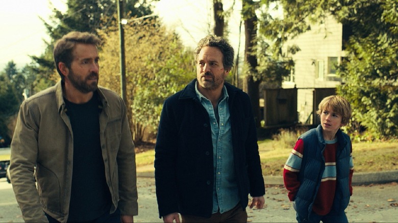 Ryan Reynolds, Mark Ruffalo, and Walker Scobell walking
