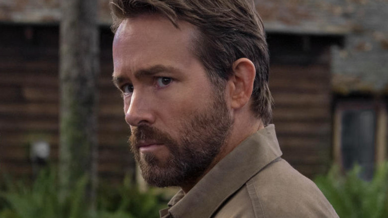 Ryan Reynolds looking to the side in still from The Adam Project