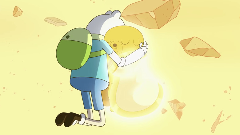 Finn and Jake hugging in Adventure Time: Distant Lands