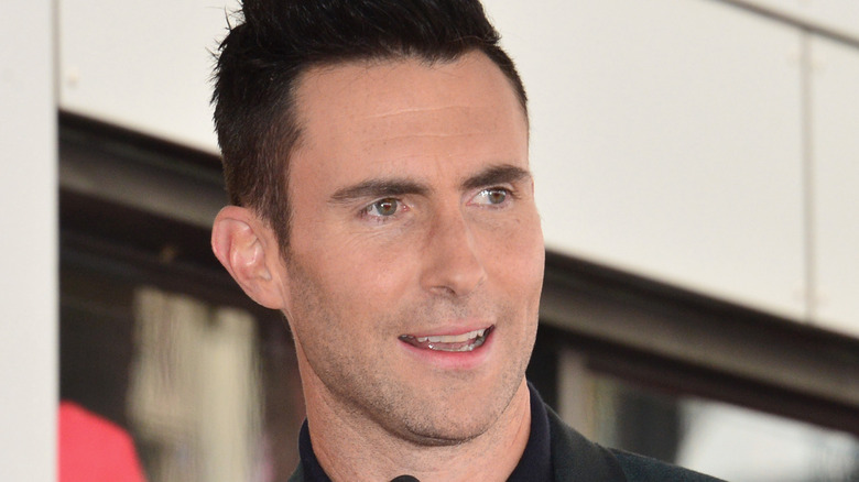 Adam Levine speaking at an event