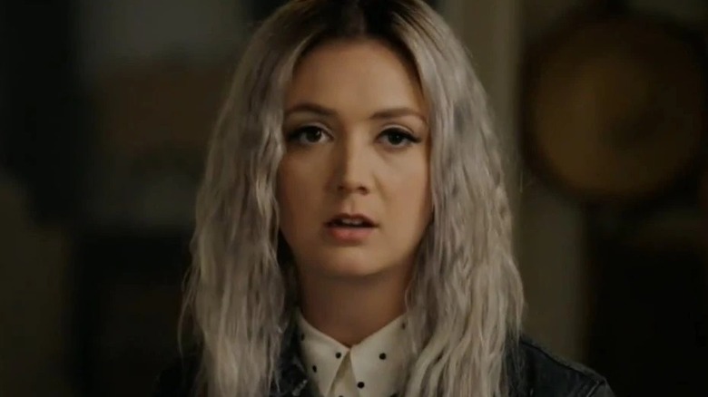 Billie Lourd looking on