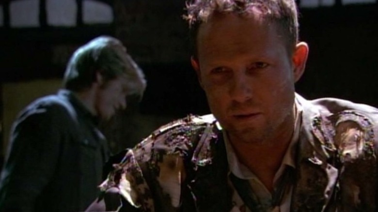 Tommy Gavin stands behind his brother Johnny Gavin on Rescue Me.