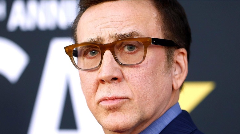 Nicolas Cage at event wearing glasses