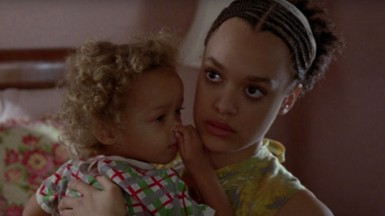 Asylum Alma Walker holding baby