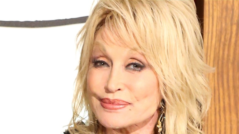 Dolly Parton smirking