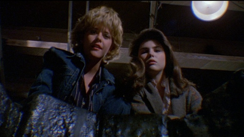 Amityville girls peer into hole