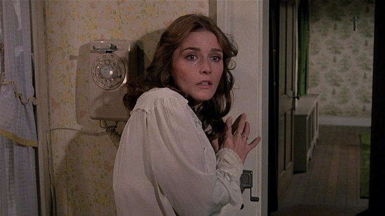 Kathy Lutz crying looking scared near telephone (1979)