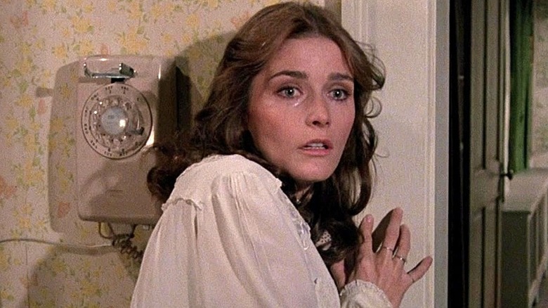 Kathy Lutz crying looking scared near telephone (1979)