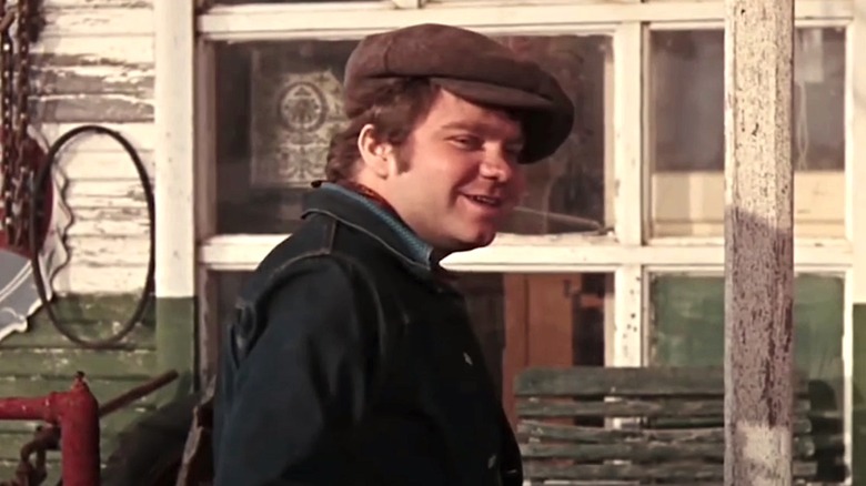 C.W. Moss wearing hat