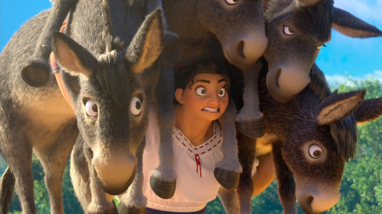 Luisa carries all the donkeys in Encanto 