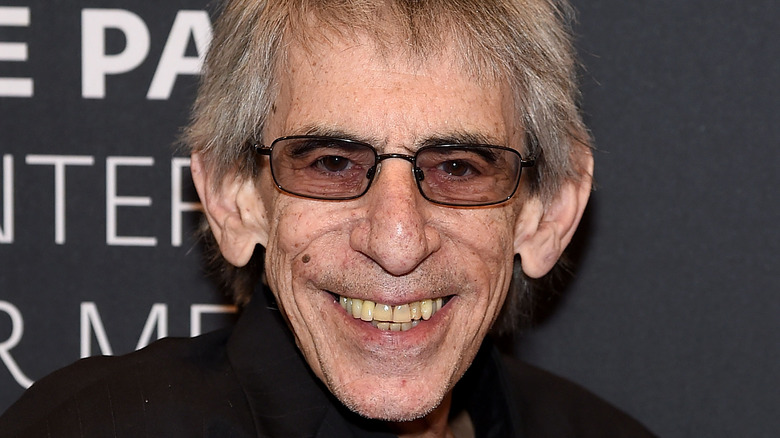 Richard Belzer smiling with glasses