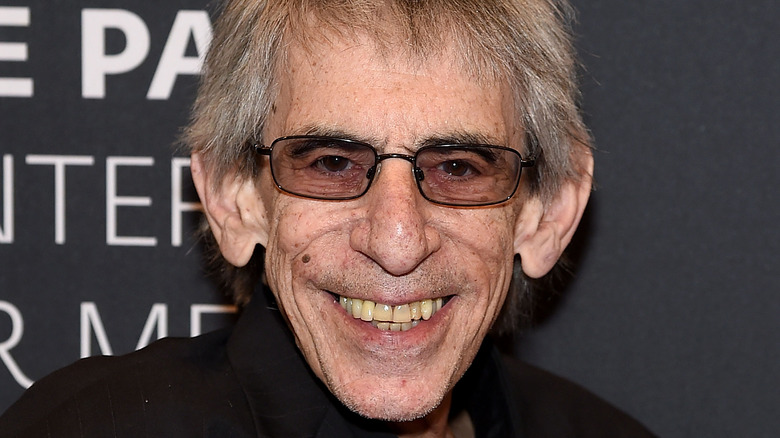 Richard Belzer smiling with glasses