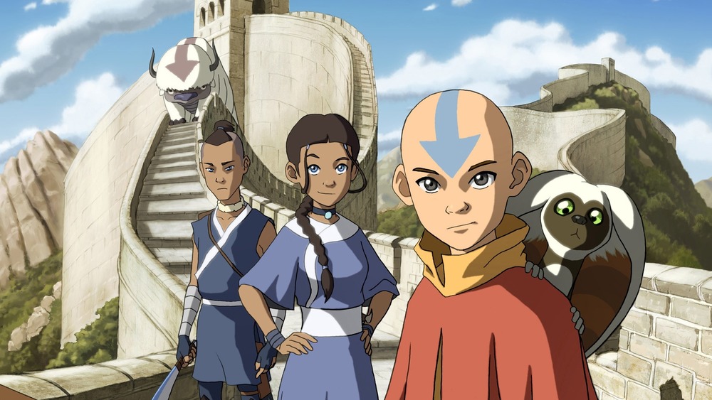 Aang, Katara, and Sokka stand on great wall