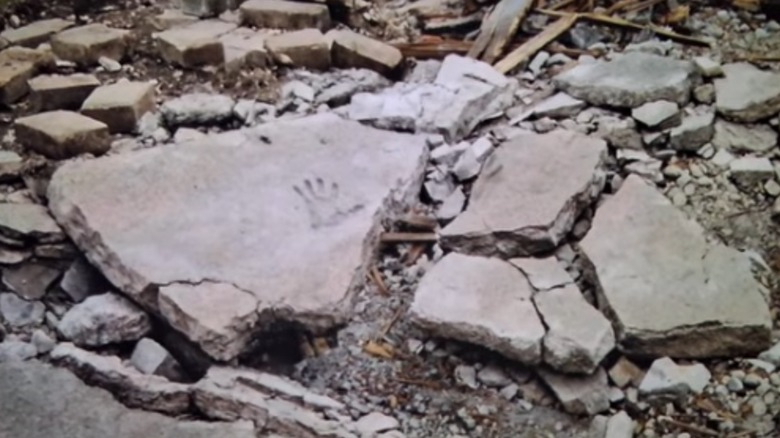 Broken sidewalk at Mary's old house in Backrooms (2026)