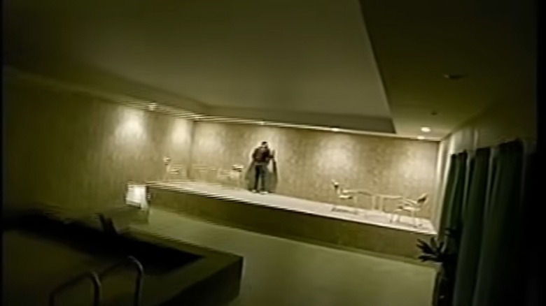 Clark talks to Kat through a wall in Backrooms (2026)