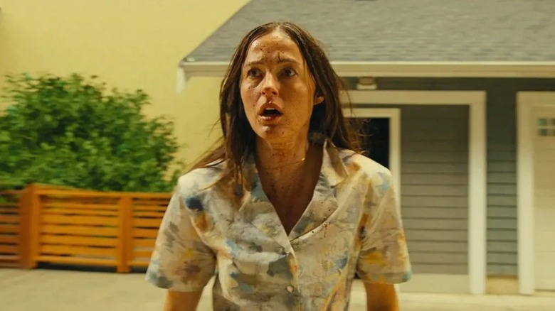 Mary next to a recreation of her childhood home in "Backrooms" (2026)