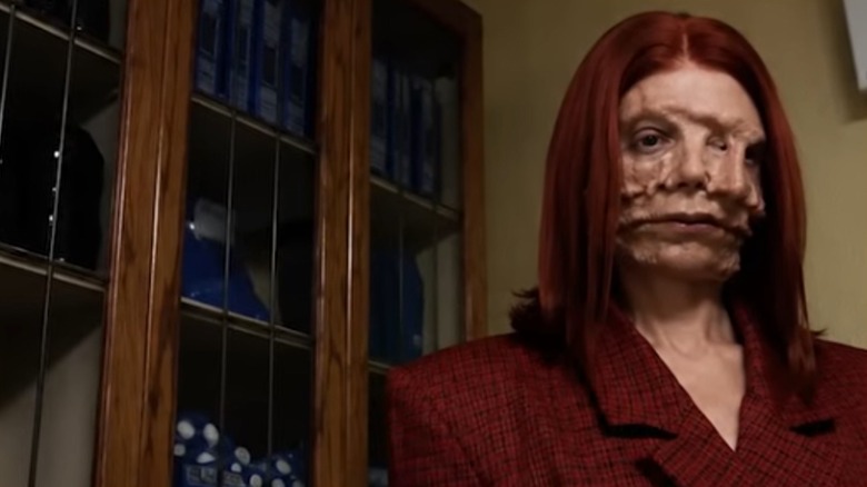 A Still Life woman with red hair in "Backrooms" (2026)