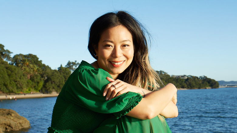 Michelle Ang sitting by shore