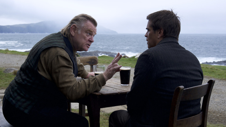 Colin Farrell and Brandan Gleeson sitting and talking