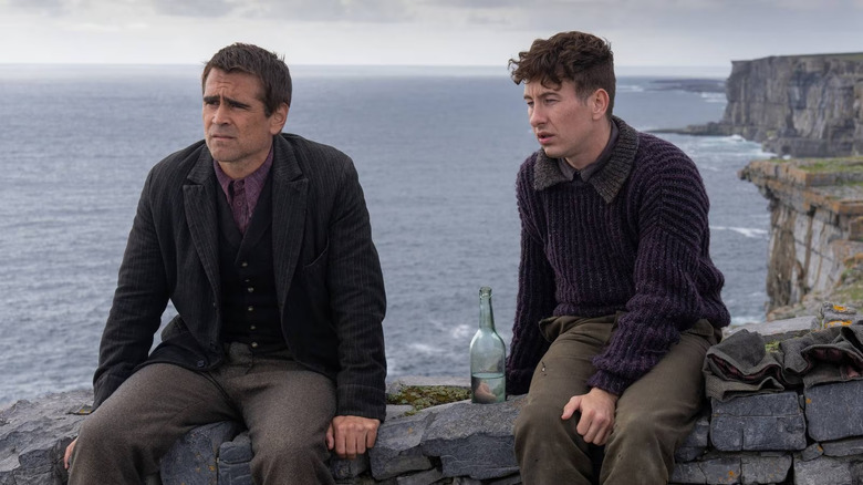 Pádraic and Siobhán drinking on stone wall