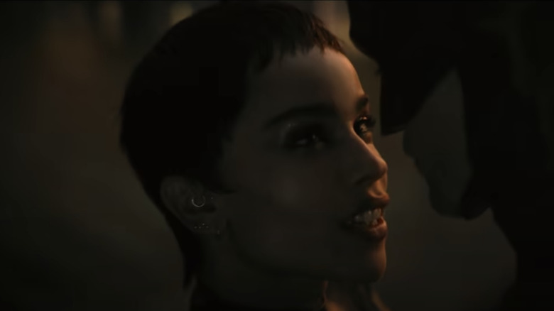 Catwoman and Batman about to kiss