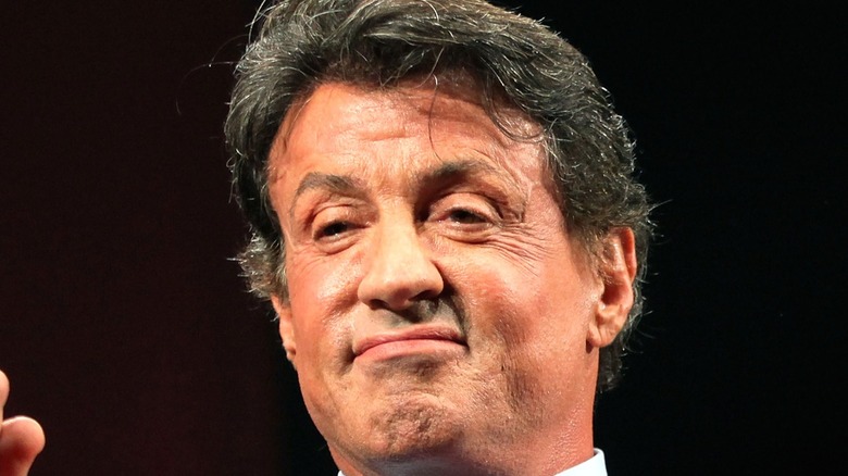 Sylvester Stallone smirking