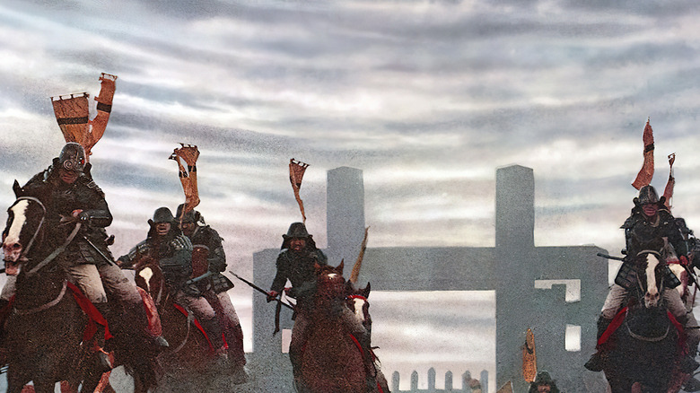 Soldiers moving across a battlefield