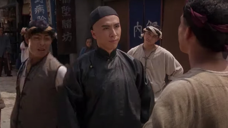 Young Donnie Yen facing down an opponent