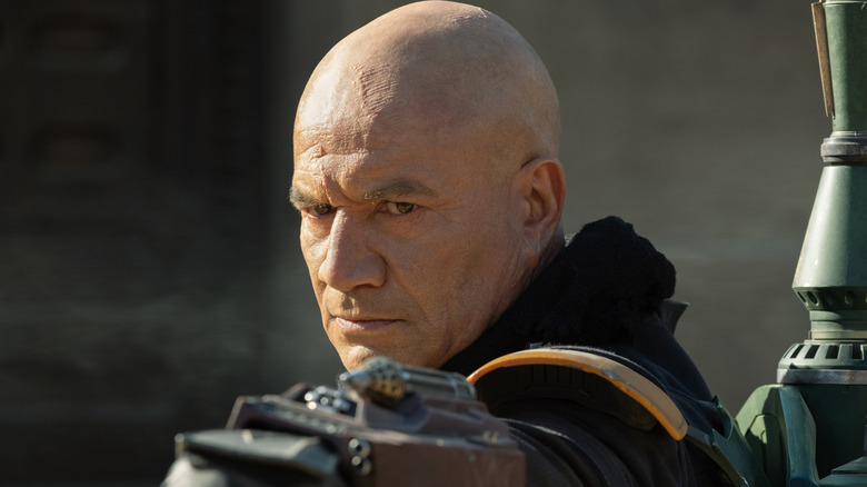 Boba Fett aiming a blaster