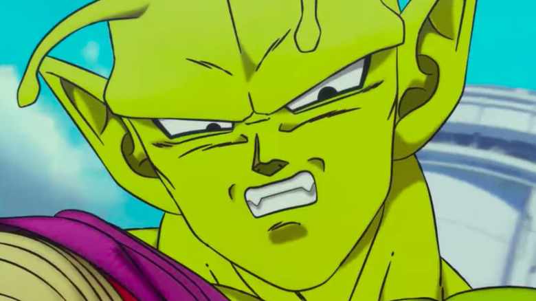 Piccolo snarls while blocking an attack