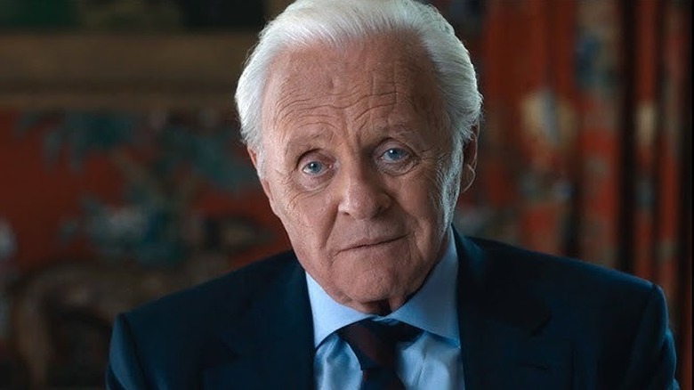 Anthony Miller in a blue suit and tie in "The Son" (2022)