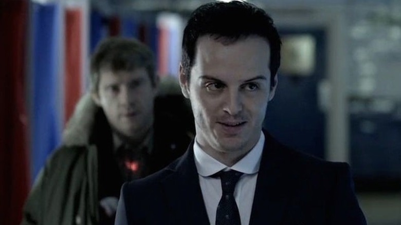 Sherlock points gun at Moriarty