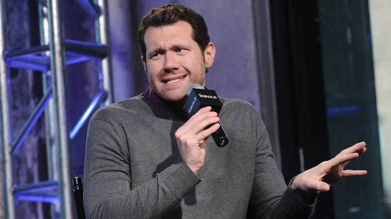 Billy Eichner making a funny expression onstage at AOL Build (2015)