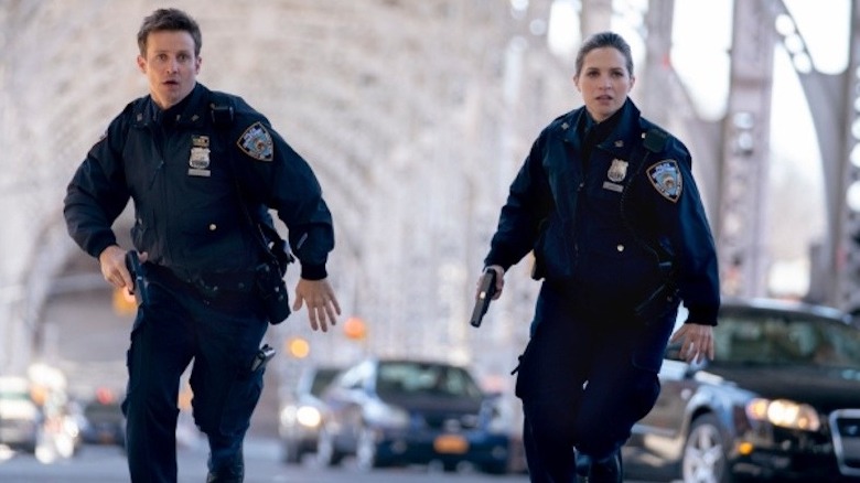 Jamie Reagan and Eddie Janko running with guns