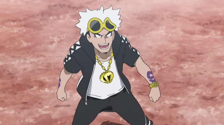 Guzma standing in an open field and smirking