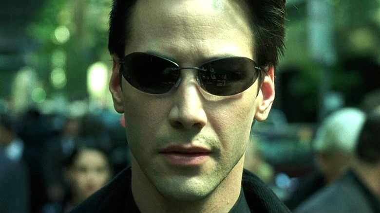 Neo wearing glasses