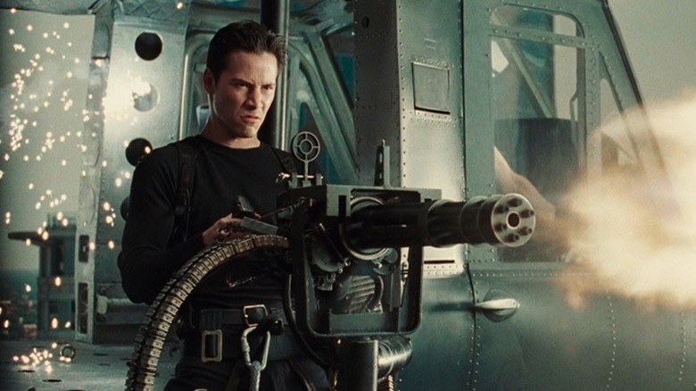 Neo fires a Gatling gun