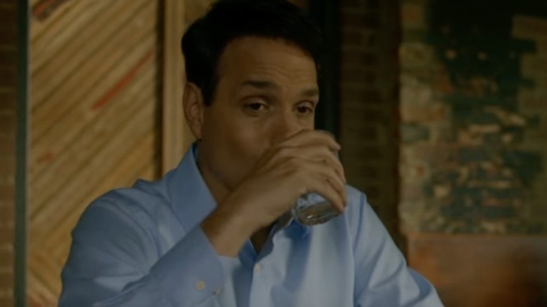 Daniel LaRusso drinking whiskey